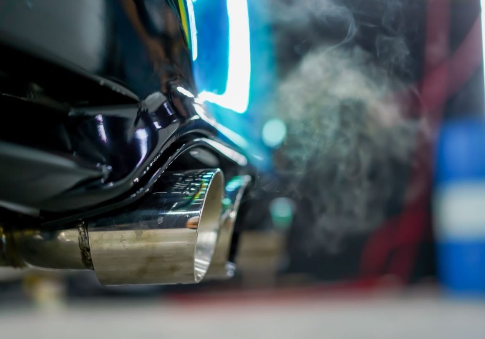 close-up-of-the-exhaust-pipe-emitting-smoke-from-a-2023-12-29-22-24-18-utc