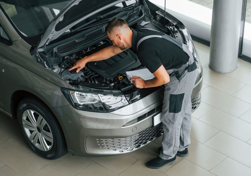 engine-repair-man-in-uniform-is-working-in-the-au-2023-11-27-05-20-15-utc